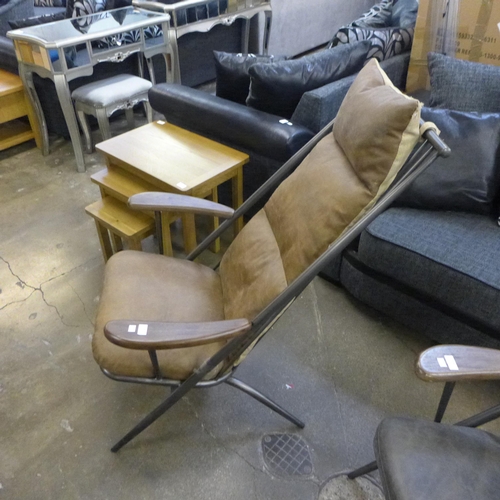 1450 - An Ely tan leather armchair -minor tears to fabric