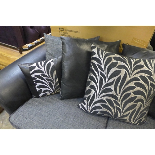 1527 - A dark grey and black fabric large two seater sofa