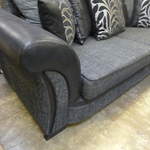 1527 - A dark grey and black fabric large two seater sofa