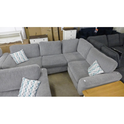 1547 - A light grey fabric corner sofa