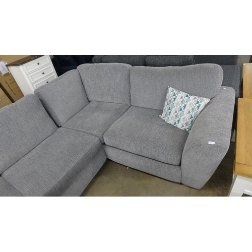 1547 - A light grey fabric corner sofa