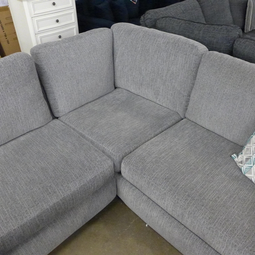1547 - A light grey fabric corner sofa