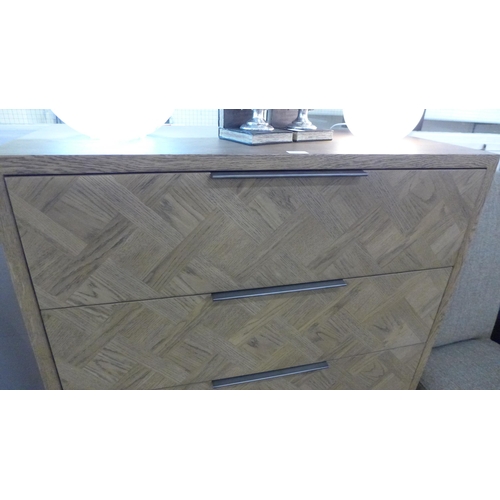 1335 - An oak and steel four drawer chest ( slight damage to top ) * Tis lot is subject to VAT