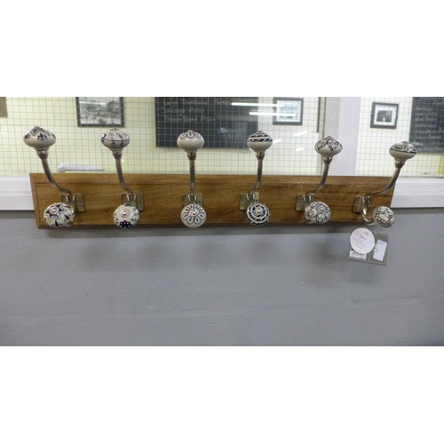 1377 - A rack of six coat hooks with ceramic knobs (HH565424)   #