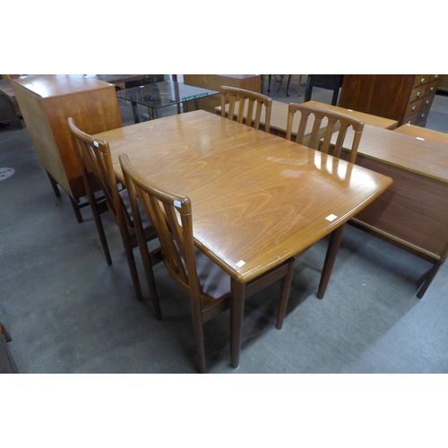 102 - A Meredew teak extending dining table and four chairs