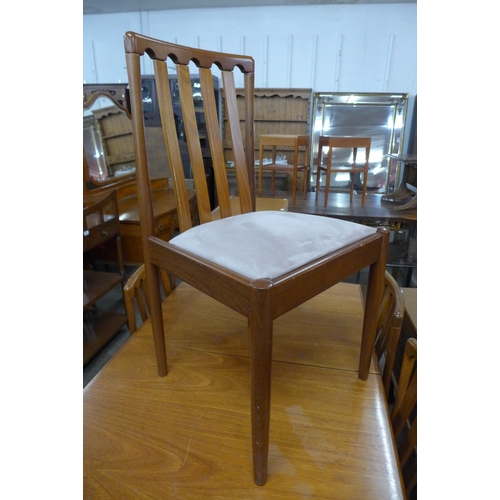 102 - A Meredew teak extending dining table and four chairs