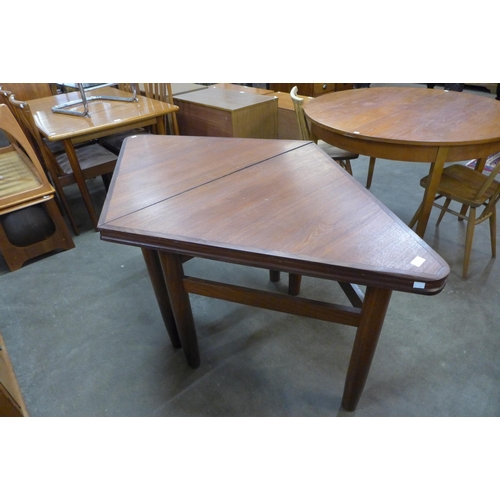 103 - A pair of teak triangular side tables