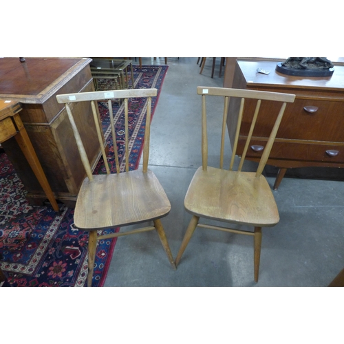 104 - A pair of Ercol Blonde elm and beech 391 model chairs