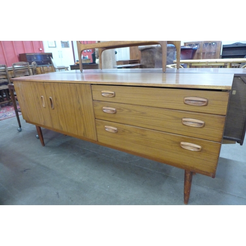 114 - A teak sideboard