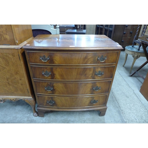 131 - A Reprodux mahogany bow front chest of drawers