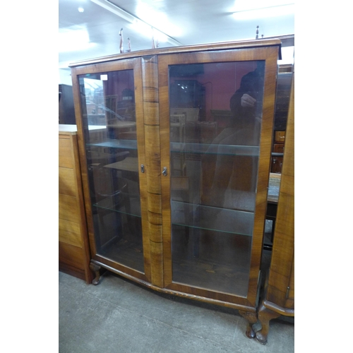 132 - A walnut two door display cabinet