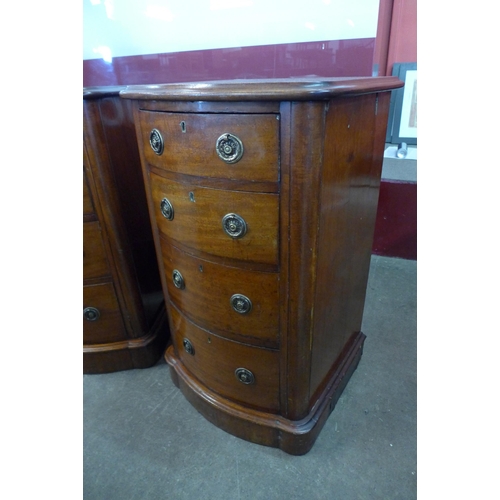 14 - A pair of Victorian mahogany bow front pedestal chests