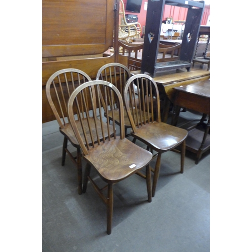 150 - A set of four Victorian elm and beech Windsor kitchen chairs