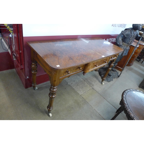 16 - A Victorian burr walnut three drawer writing table