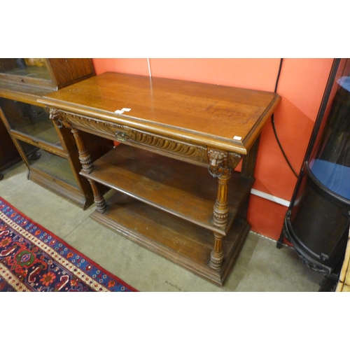 21 - A Victorian carved oak three tier buffet