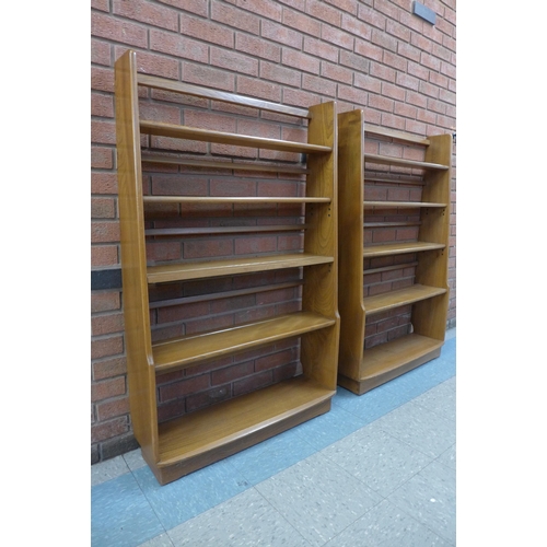 54 - A pair of Ercol Golden Dawn ash open bookcases