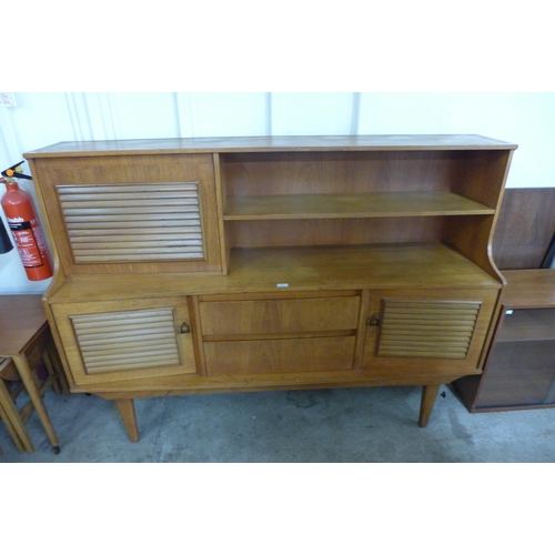 61 - A teak highboard