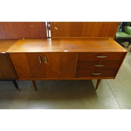 65 - A teak and oak sideboard