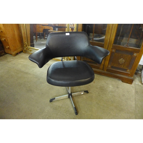 94 - A chrome and black vinyl revolving desk chair