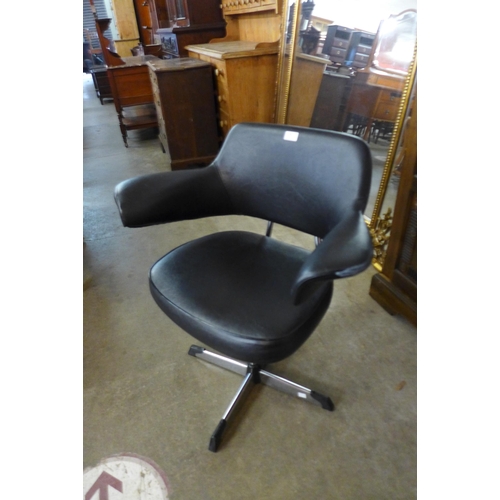 94 - A chrome and black vinyl revolving desk chair