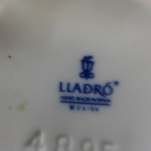 615 - Three Lladro figures, (girl with piglet 17cm and a/f)