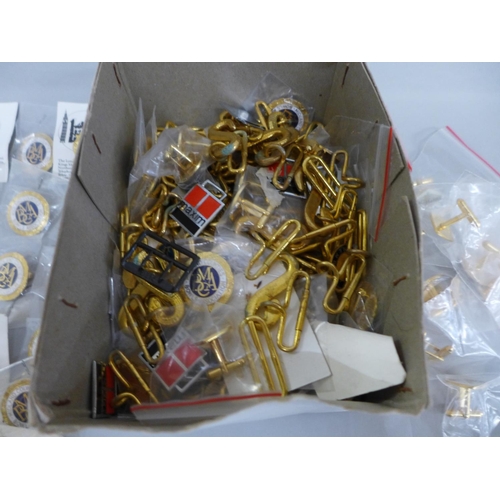 626 - A box of pin badges, cufflinks and buckles