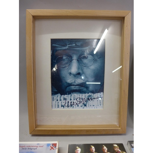 722 - Dad's Army, a signed Clive Dunn photograph, framed, with certificate, three books and two DVD's