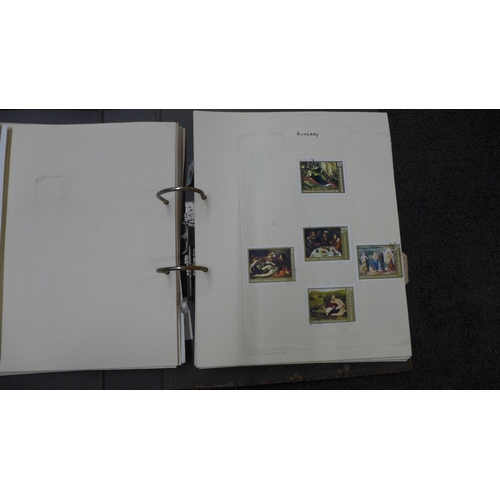 773 - A collection of world stamps in three albums and two stamp catalogues