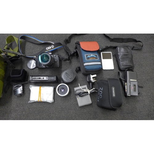 778 - An Olympus OM-D digital camera, two dictaphones and a camera bag