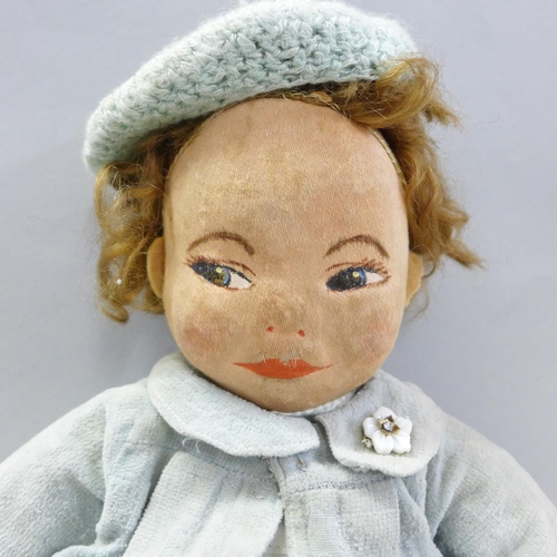 843 - A Chad Valley doll with side glance eyes and original clothes, early blue label, 39cm