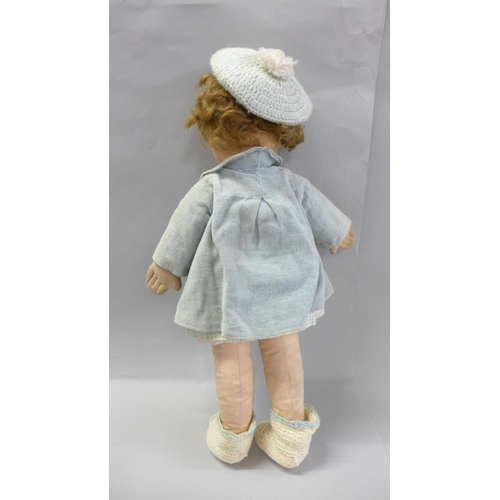 843 - A Chad Valley doll with side glance eyes and original clothes, early blue label, 39cm
