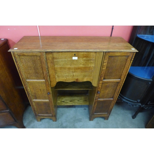 24 - An Arts and Crafts oak Cotswold School bureau bookcase