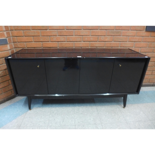 51 - A black lacquered sideboard