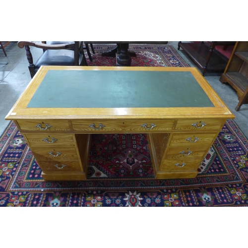 7 - A Victorian scumbled pine pedestal desk