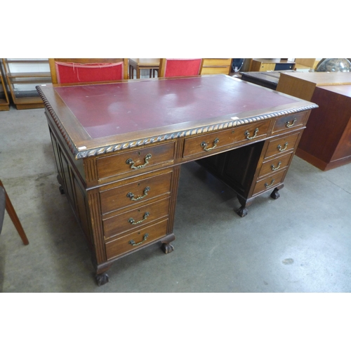 9 - A George III style carved mahogany library desk