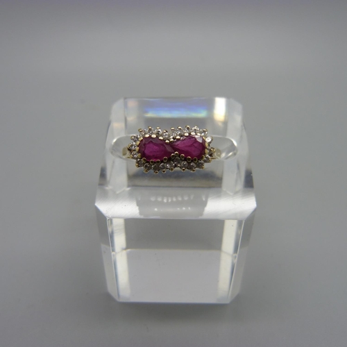 1032 - A 9ct gold, ruby and white stone ring, 2.4g, M