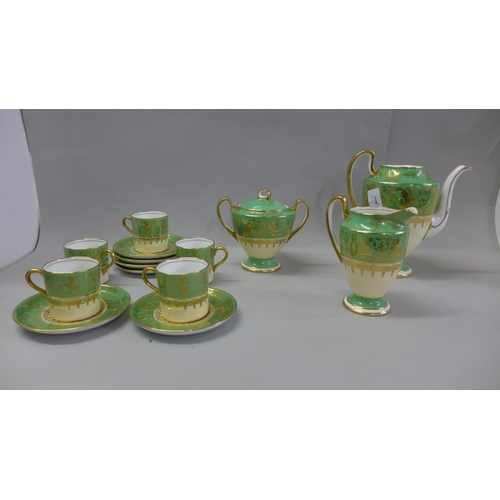 1146 - An Aynsley green, gold and white part coffee set comprising five cups, six saucers, cream and sugar ... 