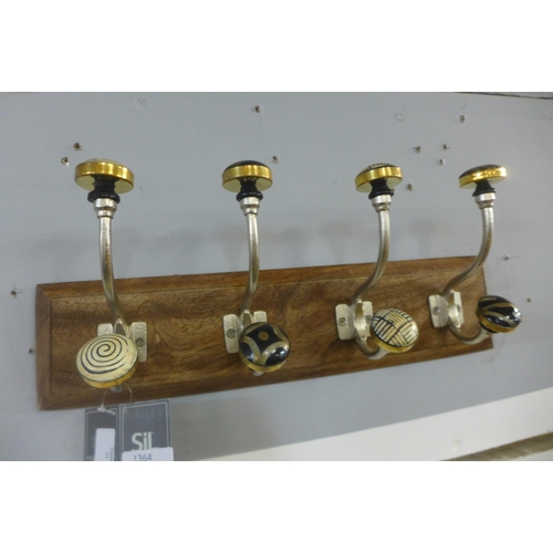 1323 - A rack of four coat hooks with ceramic knobs (HH563916)   #