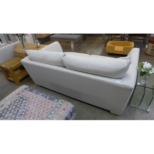 1389 - A designer cream upholstered two seater sofa (slightly marked)