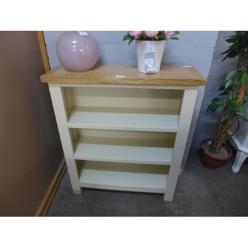 1396 - A Salisbury cream painted and oak small bookcase *This Lot is Subject to VAT*