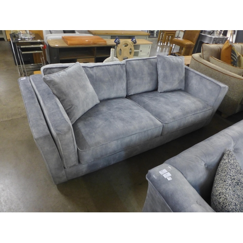 1409 - An grey velvet three seater sofa