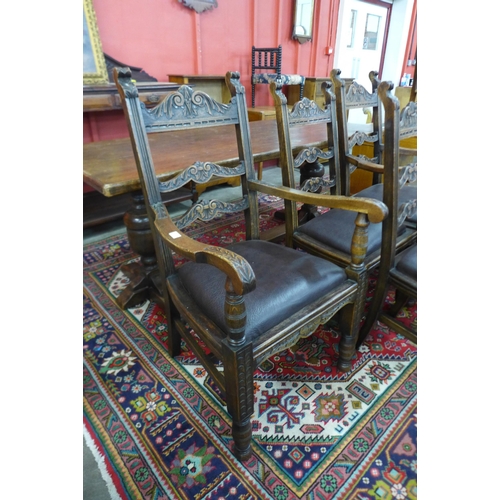 164 - A set of six Tudor style carved oak dining chairs