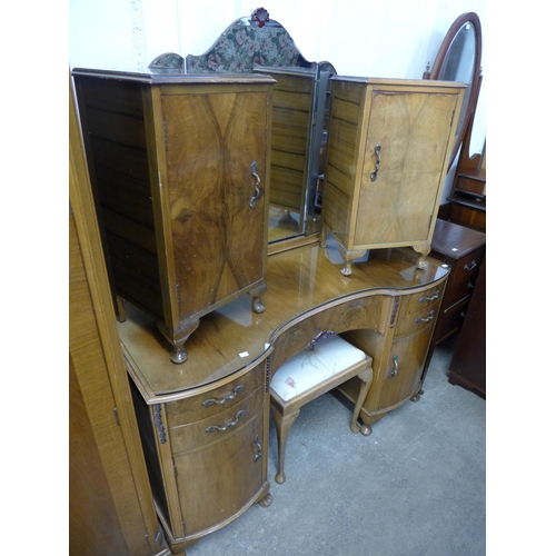 238 - A walnut five piece bedroom suite, comprising two fitted wardrobes, a dressing table and pair of pot... 