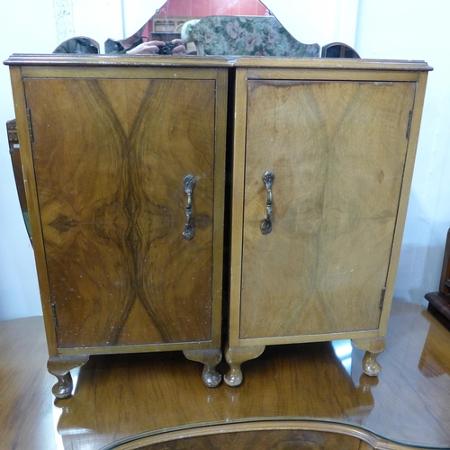 238 - A walnut five piece bedroom suite, comprising two fitted wardrobes, a dressing table and pair of pot... 