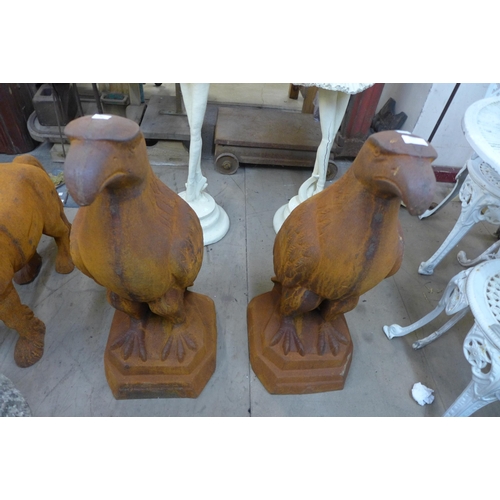 295 - A pair of large cast iron garden figures of eagles