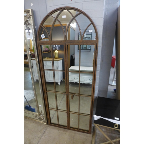 1459 - A large iron mirror in the style of an opening arched window, H 180cms, (MP1186)   #