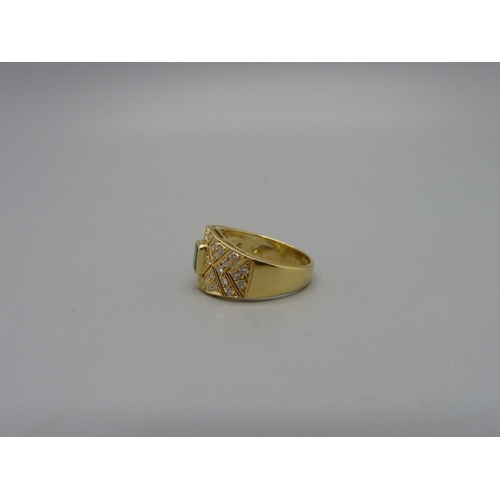 1006 - An 18ct gold, diamond and emerald ring, 5.3g, M, width of top 11mm