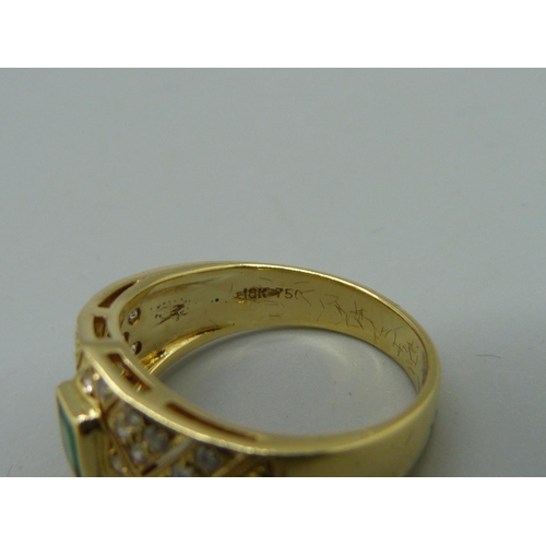 1006 - An 18ct gold, diamond and emerald ring, 5.3g, M, width of top 11mm