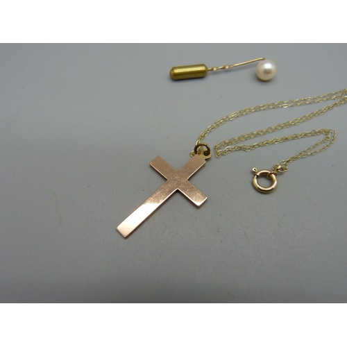 1012 - A 9ct gold cross pendant on chain, 2.4g, and a hallmarked 9ct gold and pearl stick pin, 0.7g