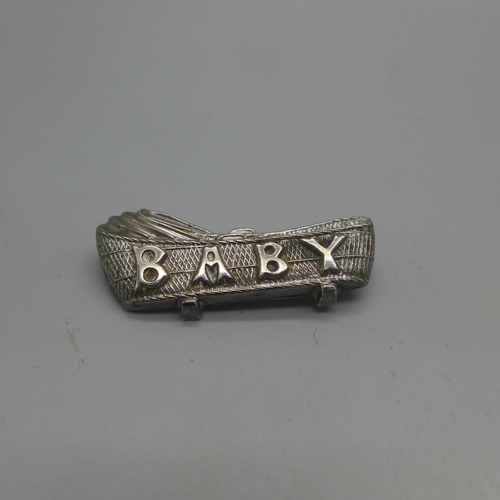 1019 - A Victorian silver 'Baby' brooch, Birmingham 1897, Loveridge & Co., a silver bracelet, a necklace an... 